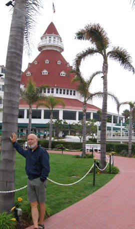 Dean holds up a palm tree at "The Del"