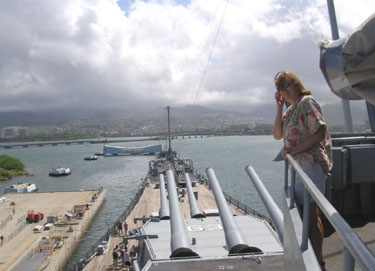 The USS Misouri looking toward the USS Arizona memorial still sunk in Pearl Harbor. 