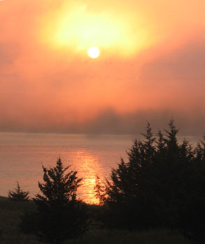 Sunrise over Lake Vermillion's morning fog.