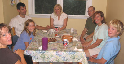 Around the kitchen table, family gathers.