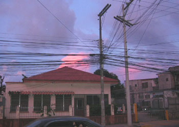 A typical La Ceiba house under the tangle of phone wires.