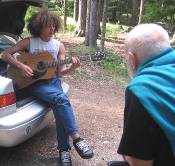 Blues singer at Acadia National Park uses a slide guitar to lure Dean in.