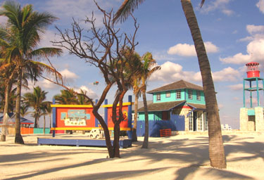 The early para-sailors floated in the sky adding to the colorful island scenery.