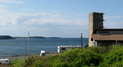 Our van in our campsite  overlooking both the Atlantic Ocean and a sizable bay.